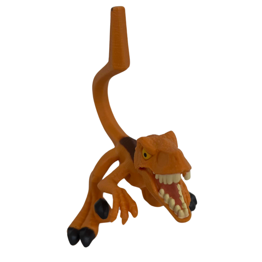 Figurine Dinosaure Atrociraptor en plastique orange avec un sourire réaliste et des détails colorés