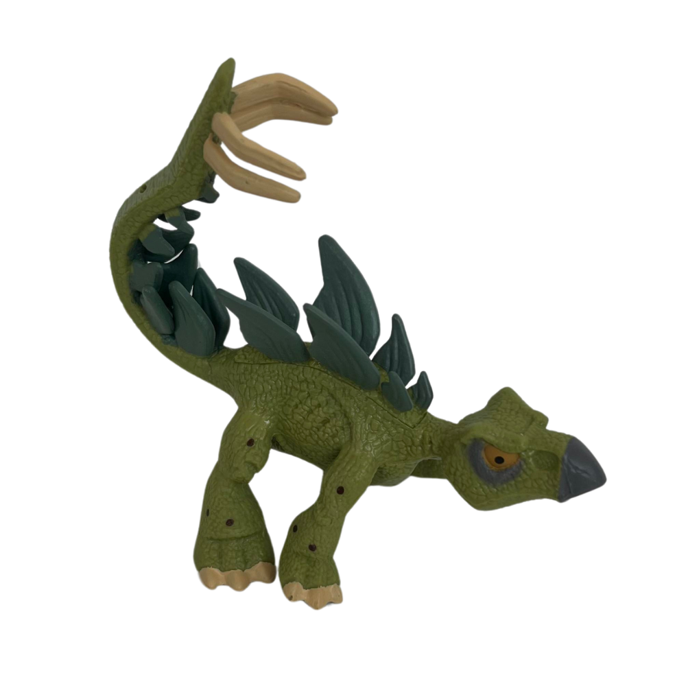 Figurine Dinosaure Stegosaurus en plastique vert avec des détails réalistes et des ailes en relief